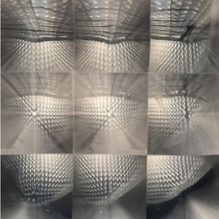 blurred photograph which is a collage, glass object visible from different angles